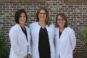 Three women doctors posing for photo