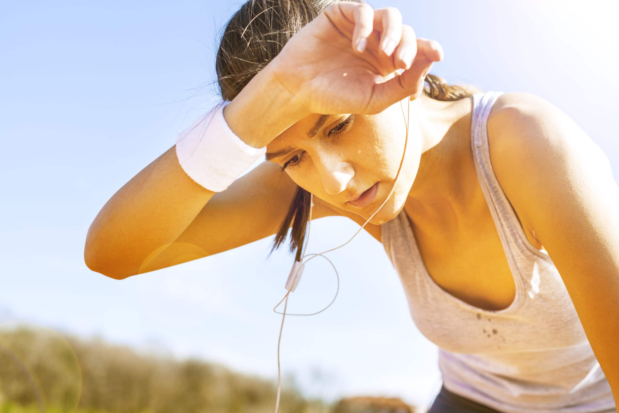 Woman feeling dehyrated after running in the heat