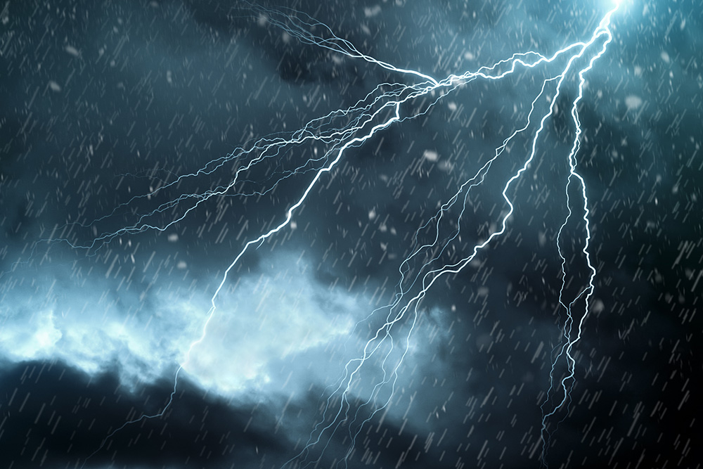 Grey clouds and lightning bolts in a rainstorm